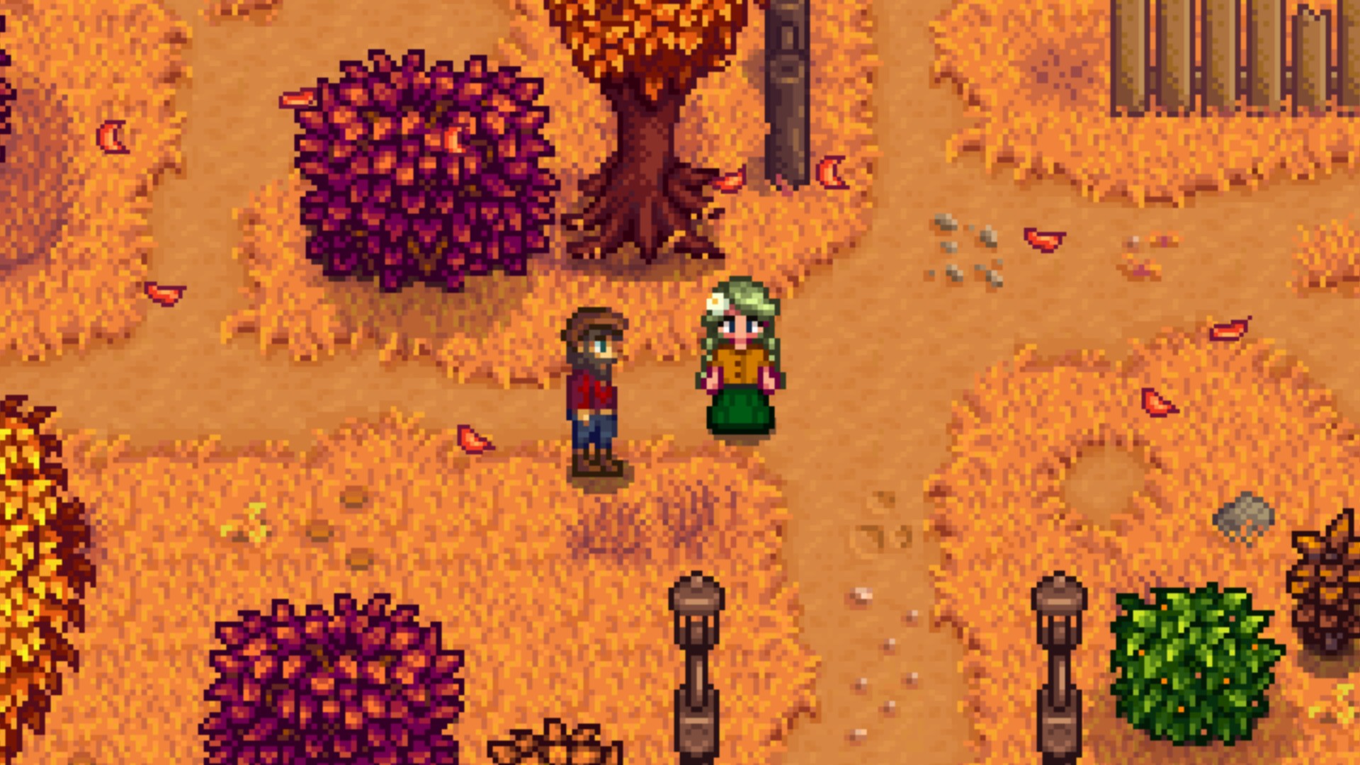 A Stardew Valley player standing beside the fishing NPC, Willy, during the fall.