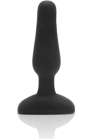 black vibrating butt plug on a white background