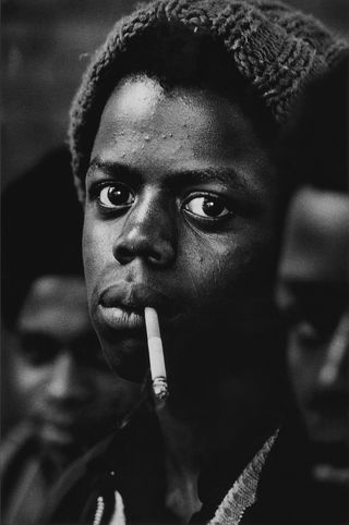 Young man in shopping centre, Bradford, England, 1970