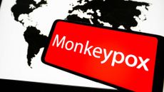 A photo illustration of a global map and the word "monkeypox."