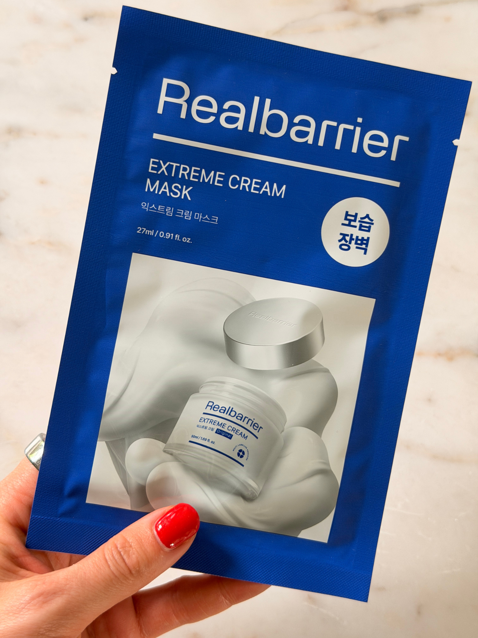 Freelance beauty editor Grace Day holding the Real Barrier face mask