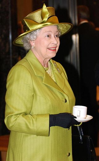 Queen Elizabeth II Drinking Tea During Her Visit To The Newly Refurbished Ministry Of Defence Building In Whitehall, London.