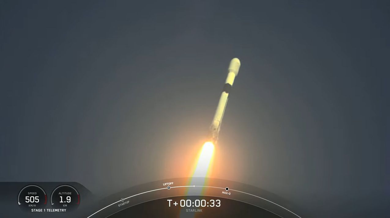 A used SpaceX Falcon 9 rocket carrying 53 Starlink internet satellites launches through a fog layer from a pad at Cape Canaveral Space Force Station in Florida on Nov. 13, 2021.