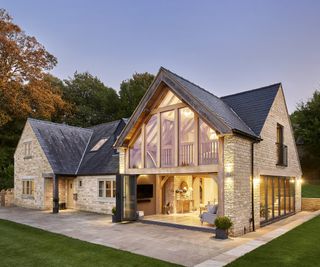 Two storey house extension built with an oak frame with grand gable roof