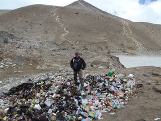 Mountain geologist Alton Byers has been studying the Himalayan region for decades. Here, he stands on a landfill at Gorak Shep, a small village at the base of Everest.