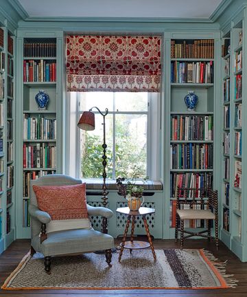 A stucco-fronted townhouse with an abundance of color and character