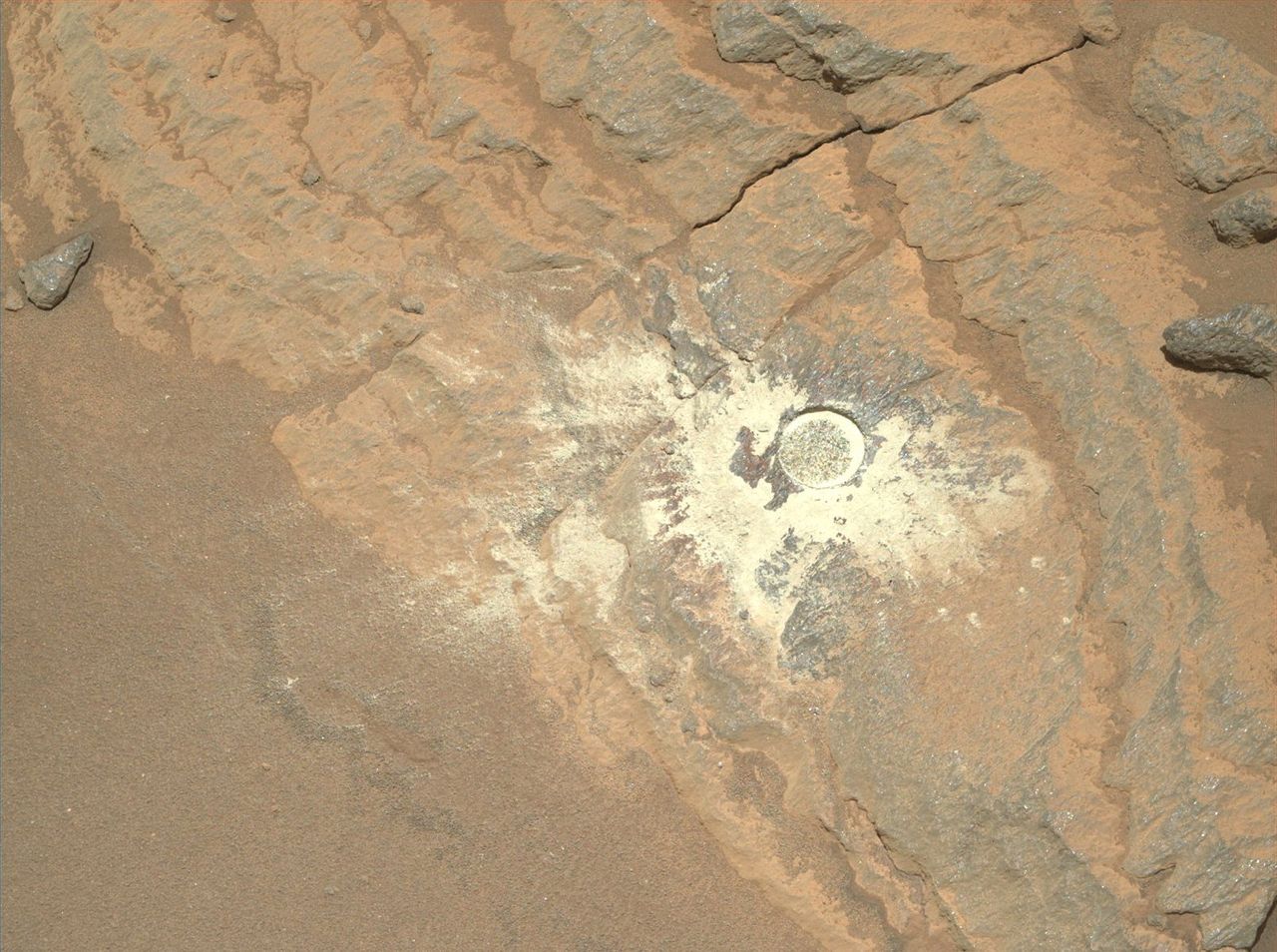 These close-up photos show the drill marks mark on a layered Mars rock under study by NASA's Perseverance rover for possible sample collection in November 2021.