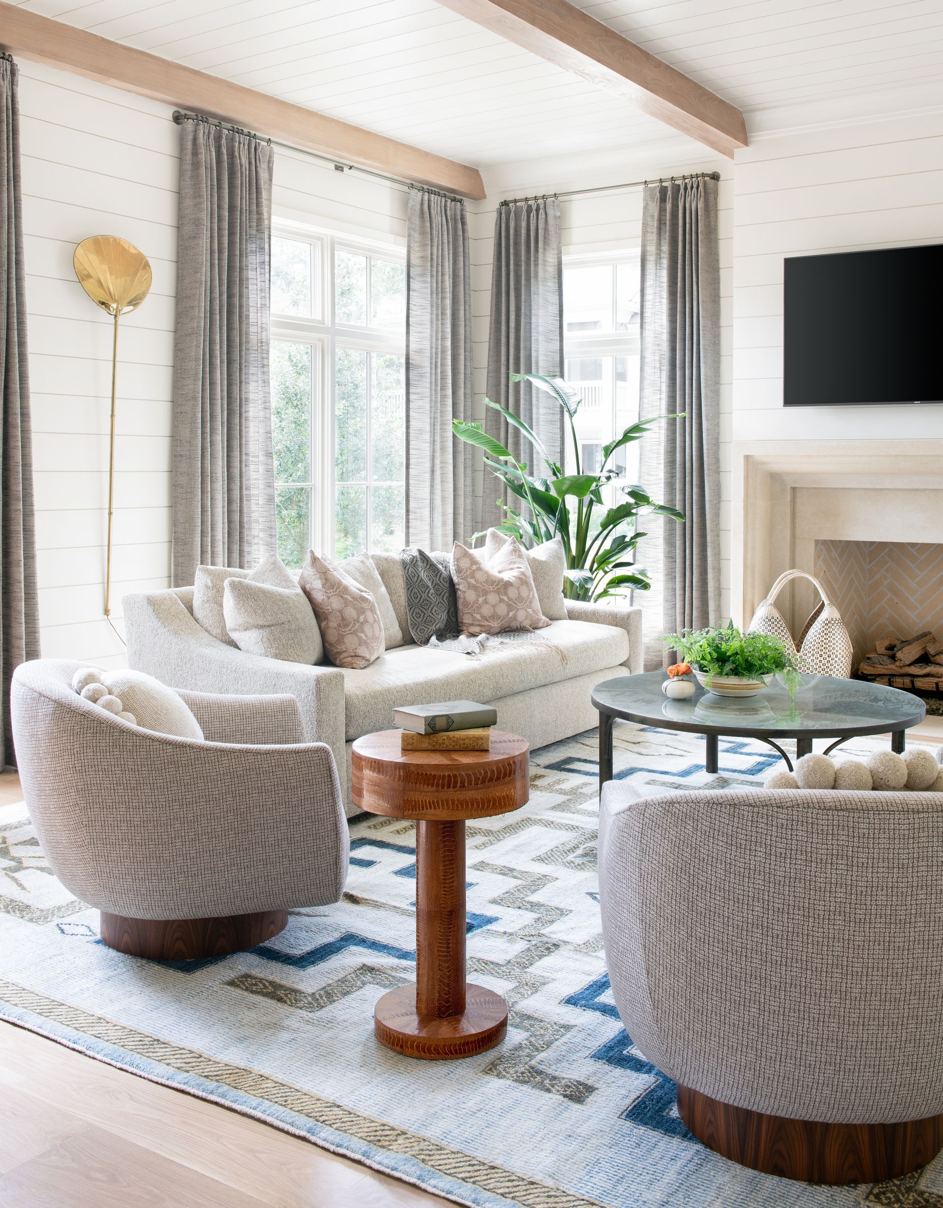 Sand colored firep;ace with tiled backing, white, horizontal walls