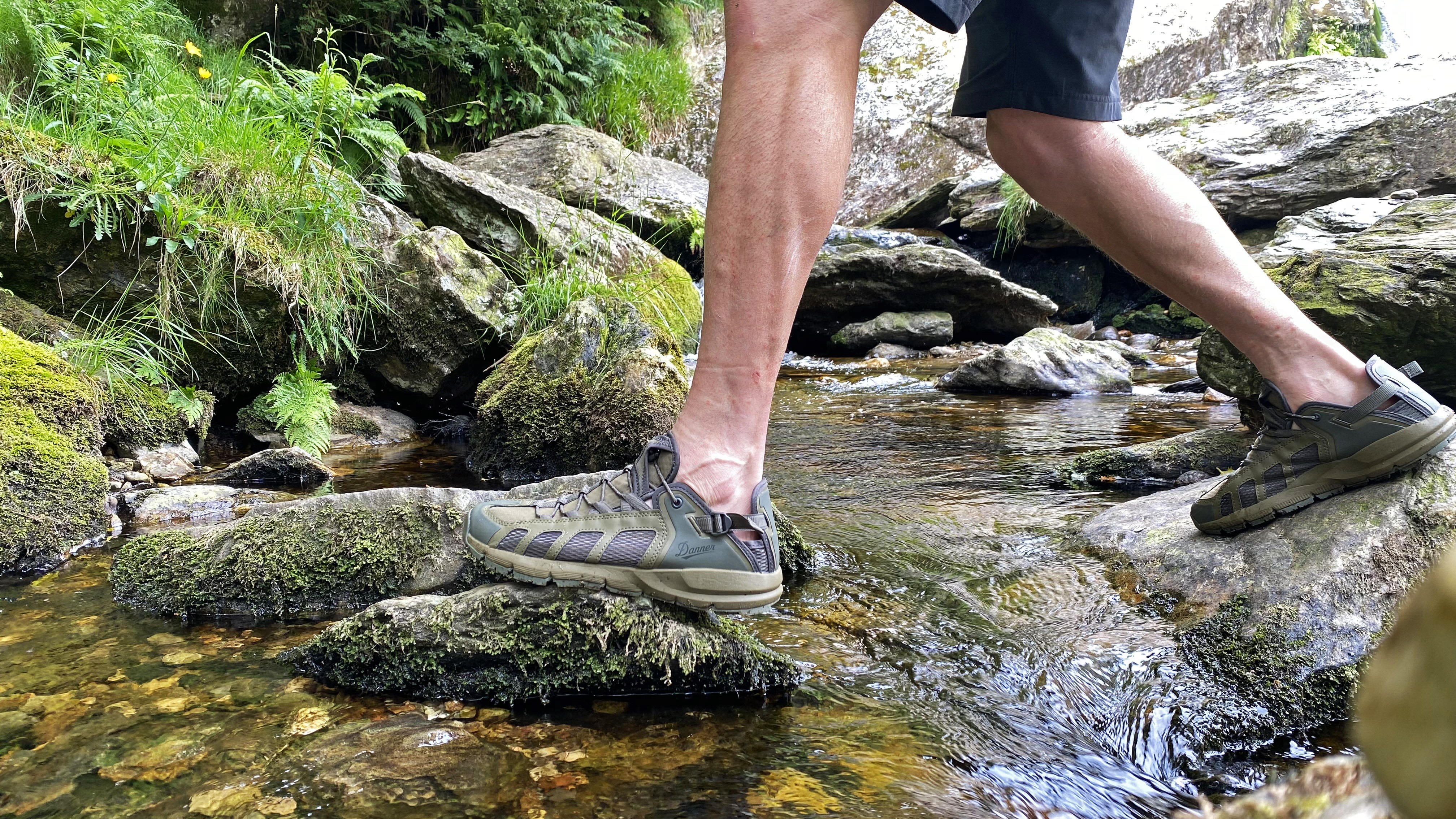 Hiker wearing the Danner Fullbore Sandals during a stream crossing