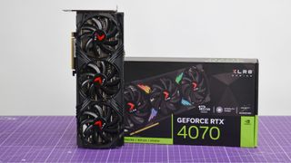 A PNY GeForce RTX 4070 XLR8 graphics card on a purple desk mat