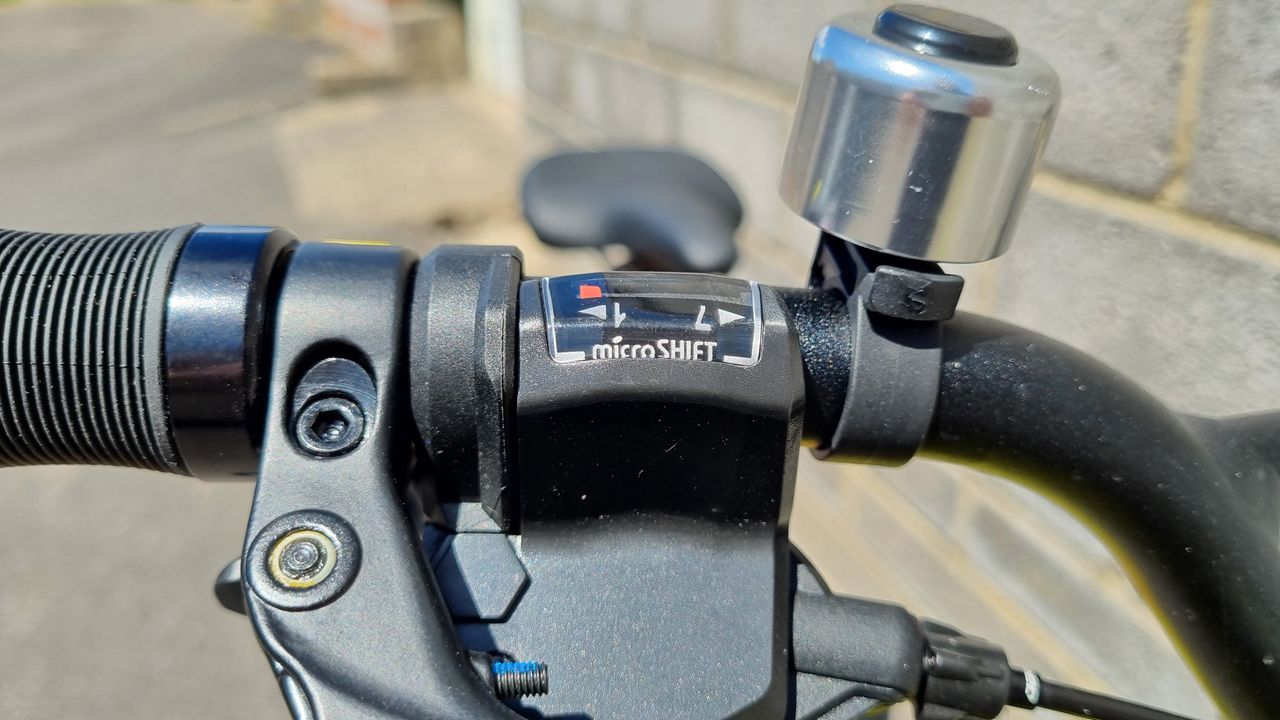 A close up of a bicycle speed gauge on a gear shifter