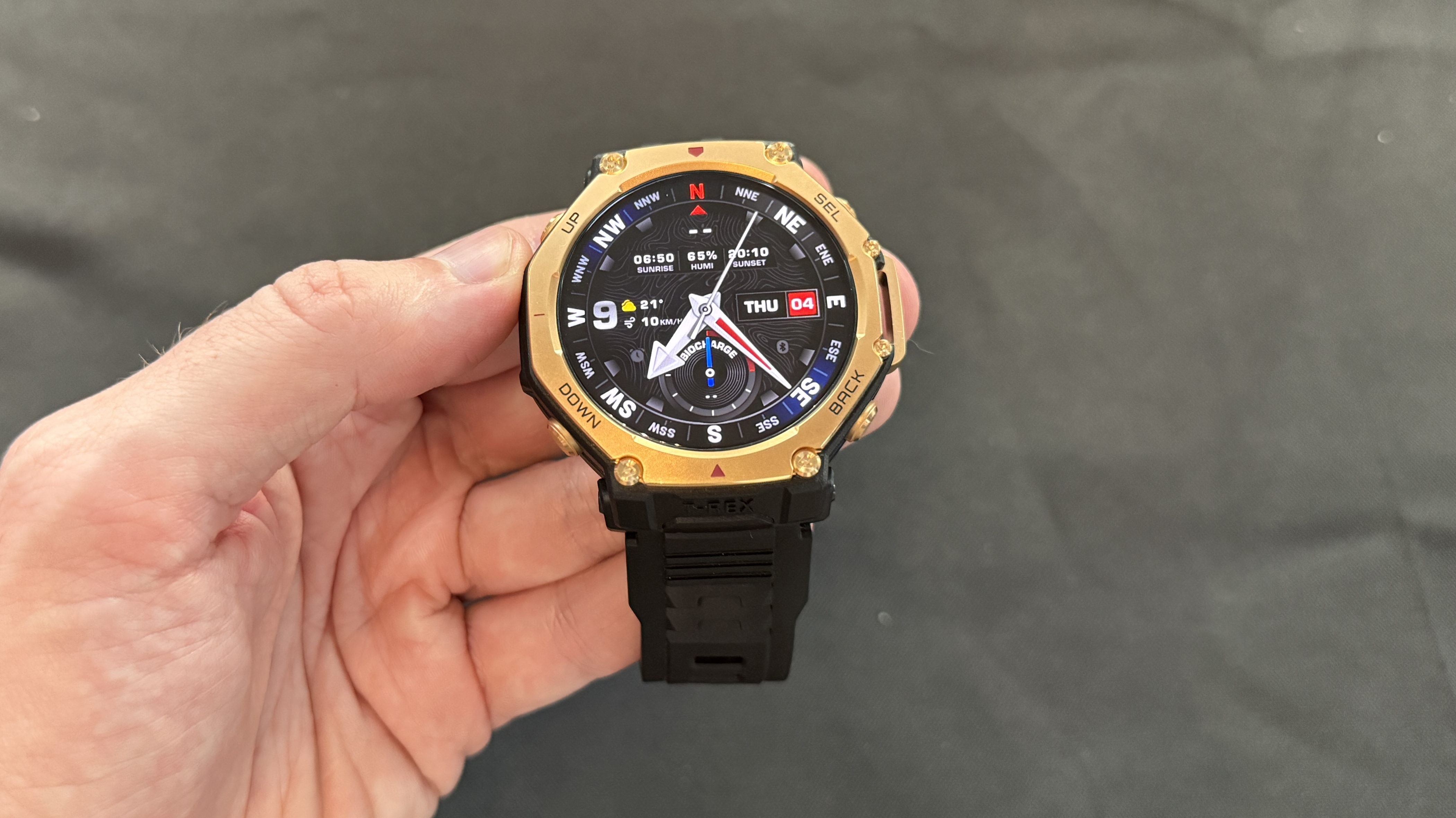 Amazfit T-Rex Pro 3 held in a man&#039;s hand
