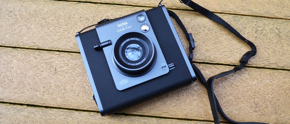 A black and gray Fujifilm Instax Wide Evo hybrid instant camera