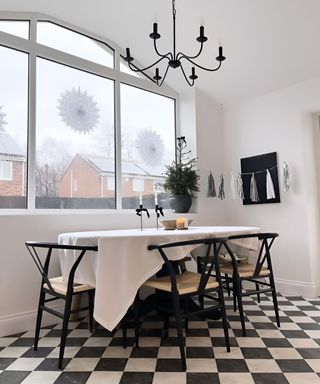 dining area in kitchen with black and white vinyl floor tiles