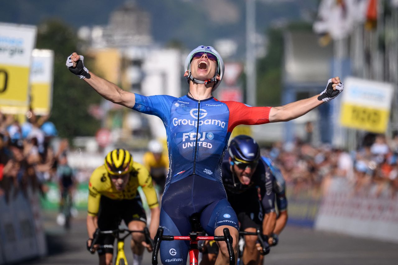 Groupama-FDJ's French rider Romain Gregoire celebrates crossing the finish line to win the second stage 157,7km from Locarno to Locarno at the Men's Tour of Switzerland (Tour de Suisse) cycling race in Locarno, Switzerland, on June 18, 2026. (Photo by Fabrice COFFRINI / AFP via Getty Images)