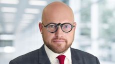 Jitterbit Chief Revenue Officer Luca Taglioretti pictured in an open plan office space.