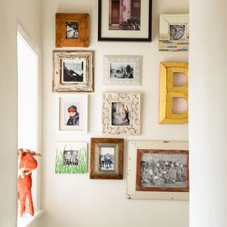 white hallway with walled pictures