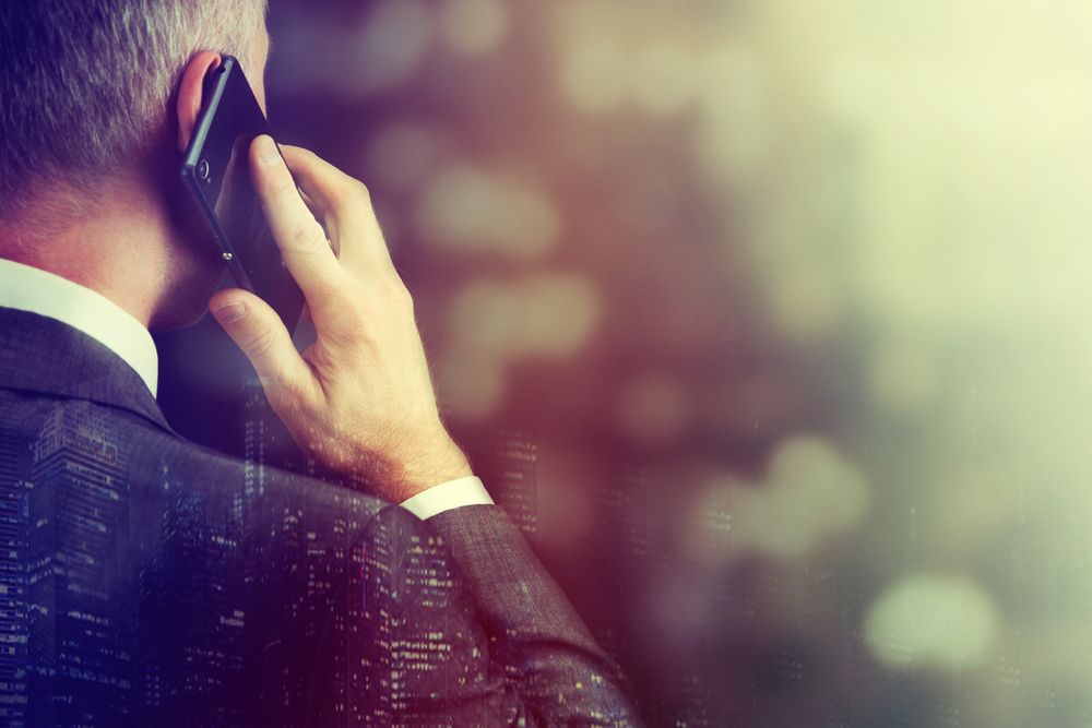 Businessman making a phone call via a 5G network