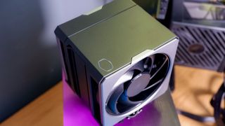 A Cooler Master Hyper 612 Apex on a desk and installed on a gaming PC.