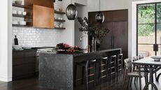 Black kitchen countertop ideas with black waterfall island