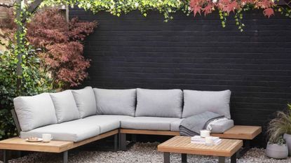 black wall with garden furniture set