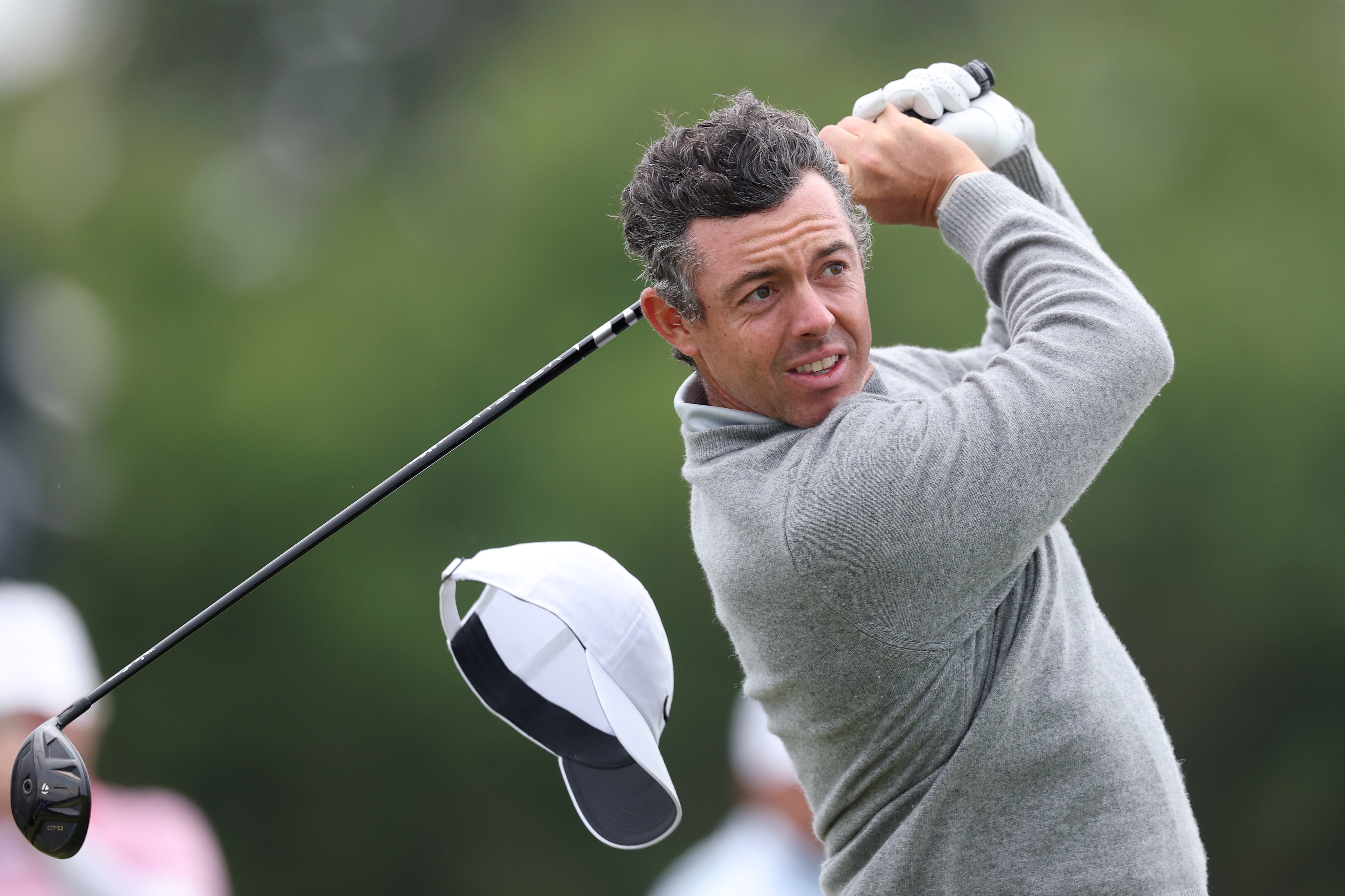 Rory McIlroy of Northern Ireland plays a shot from the 13th tee during the first round of the 126th U.S. OPEN at Shinnecock Hills Golf Club