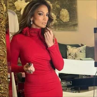 Jennifer Lopez in a red rosette dress