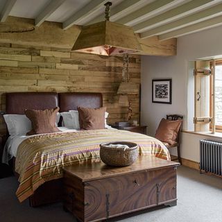 bedroom with wooden wall and lather bed