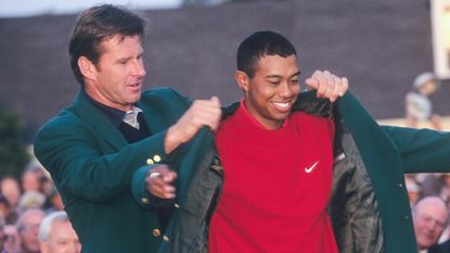 Nick Faldo hands Tiger Woods the Green Jacket at the 1997 Masters at Augusta