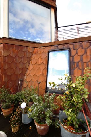 Upper terrace with Corten tiling on the roof