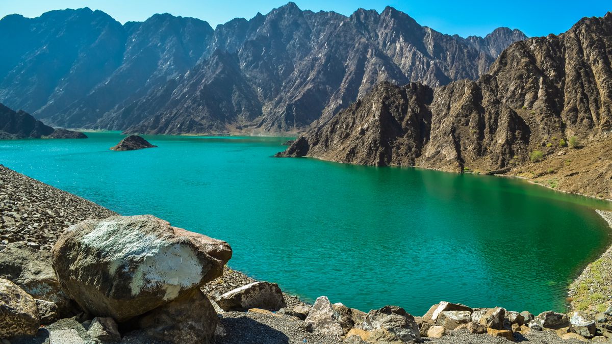 Green lake in the middle of a mountainous landscape