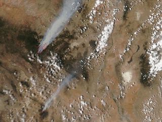 Two large fires are raging in eastern Arizona, each over 100,000 acres. The Wallow North fire is burning in east-central Arizona and the Horseshoe 2 fire is in southeastern Arizona. Both were generating a lot of smoke that was captured in an image from NA