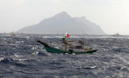 A Taiwanese fishing boat comes close to the disputed Senkaku Islands in the East China Sea, Tuesday, Sept. 25, 2012.
