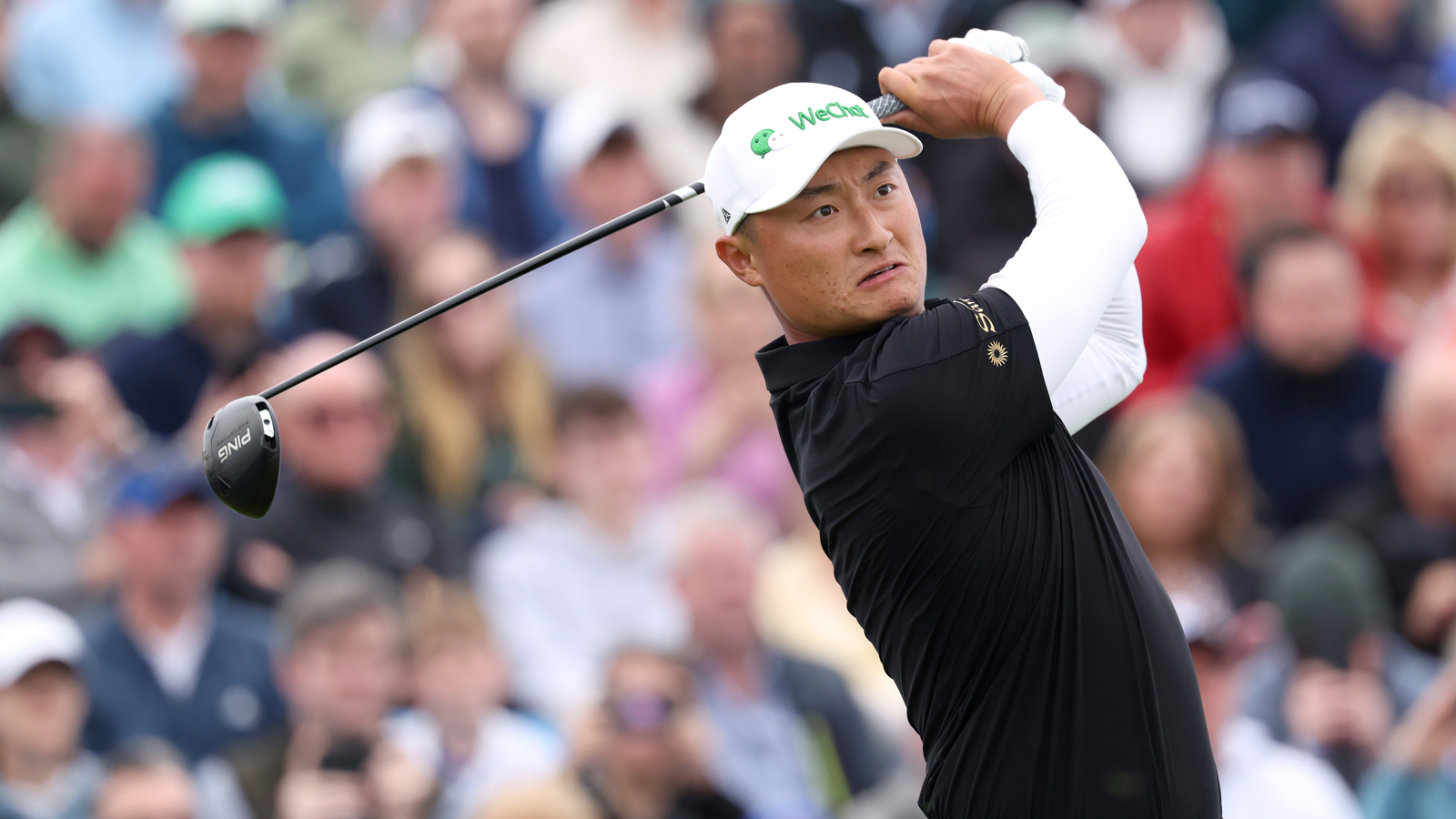 Haotong Li hits a driver