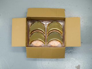 Gilded speaker parts in open box