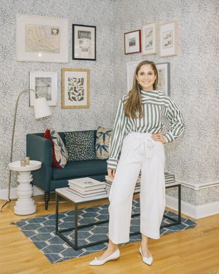 Sarah Flint wearing a printed top in her New York City apartment