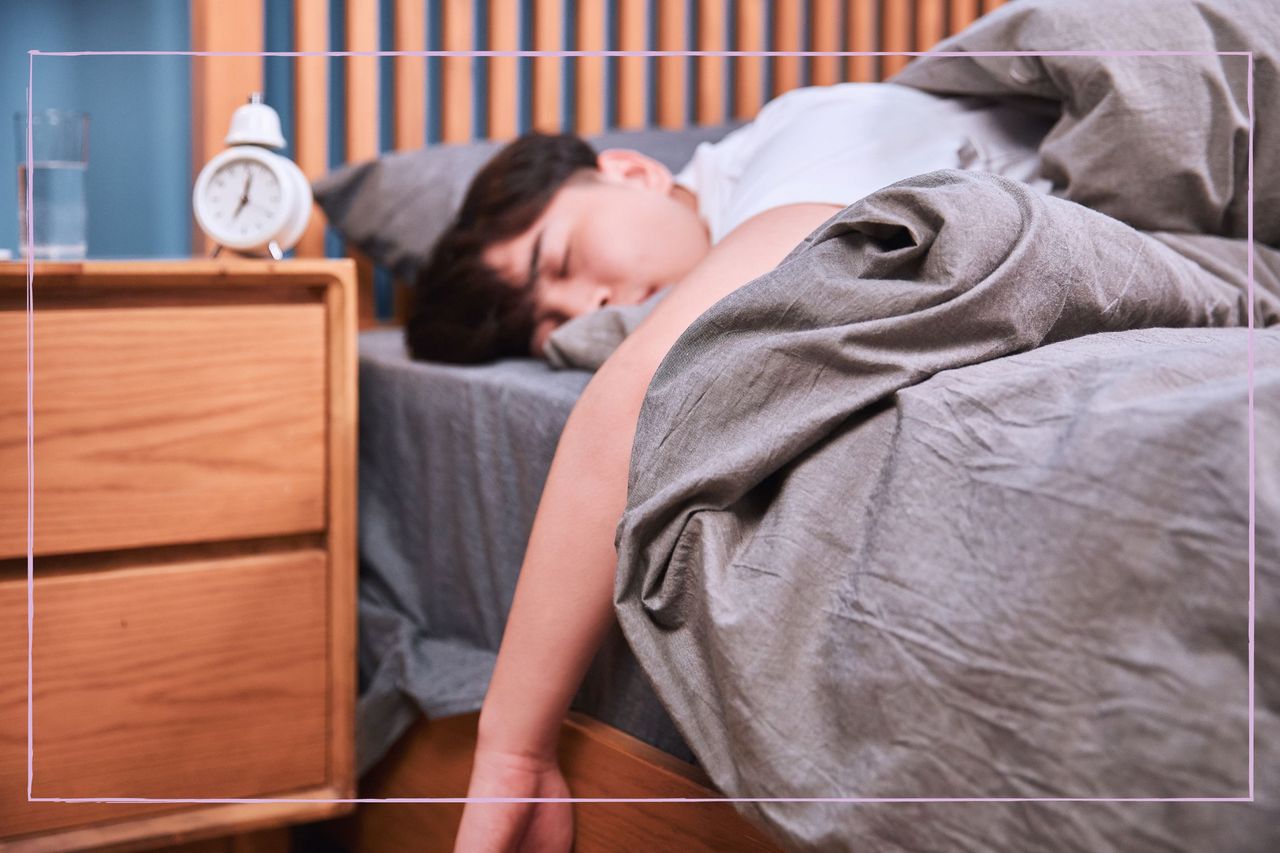 A teenage boy asleep in bed during the day