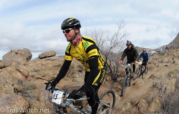A group of racers ride the outskirts of "24 Hour Town"