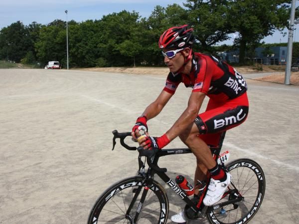 George Hincapie (BMC) cracks open a cold soda after rolling across the finish line in Stage 3 of the 2011 Tour de France.