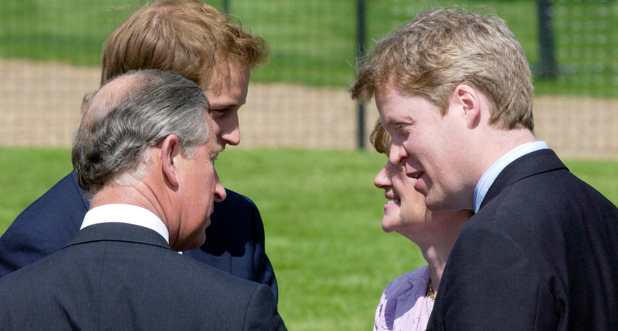 Prince Charles talking to Earl Spencer and Prince William
