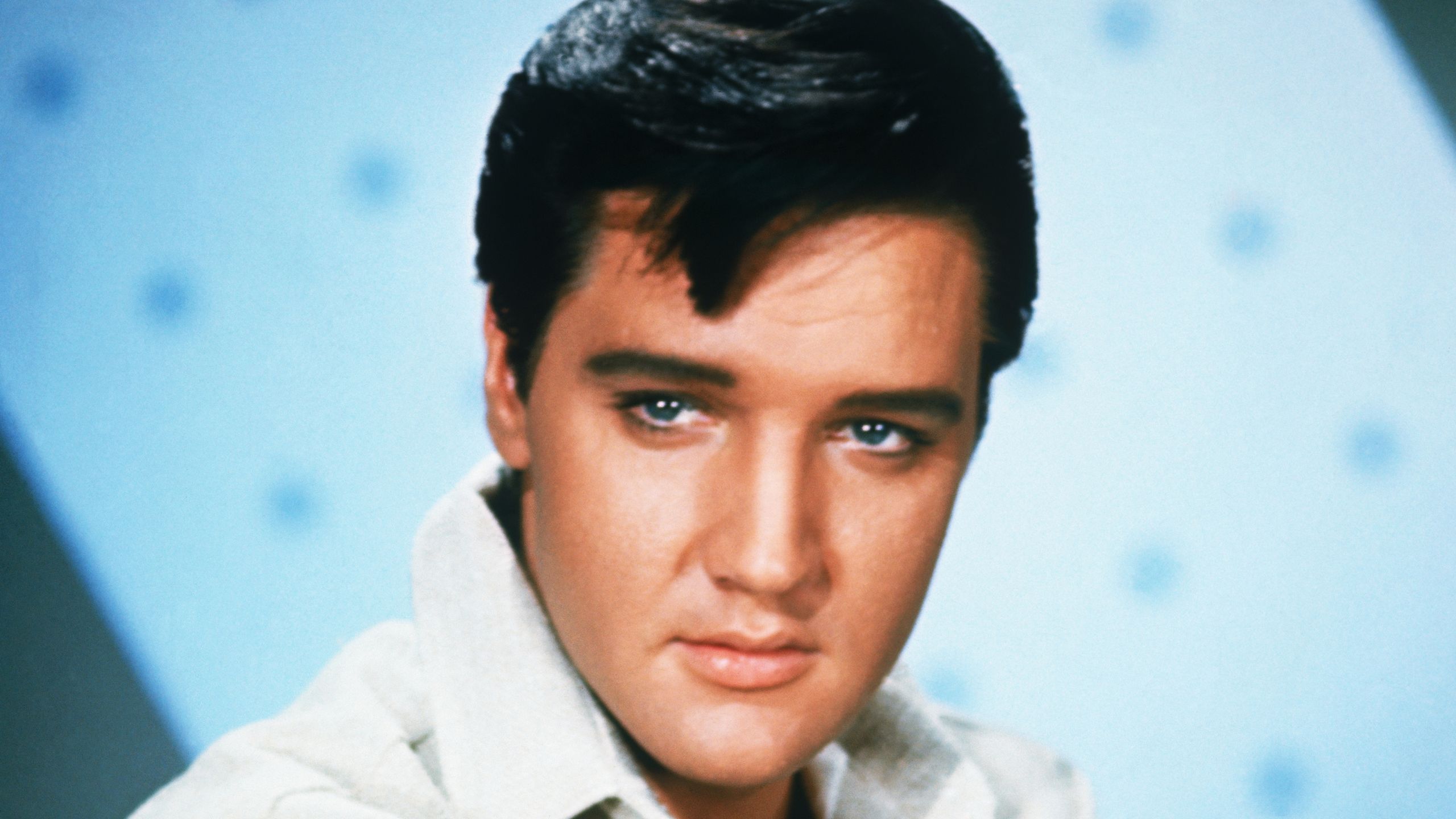 elvis presley on a blue background