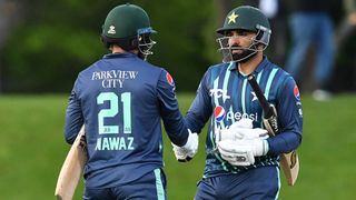 Pakistan's Mohammad Nawaz (L) and Asif Ali congratulate each other after their win during the Twenty20 tri-series cricket