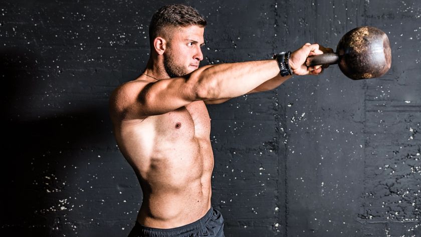 man doing kettllebell swing exercise 