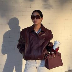 @aimeesong wearing jeans and leather jacket