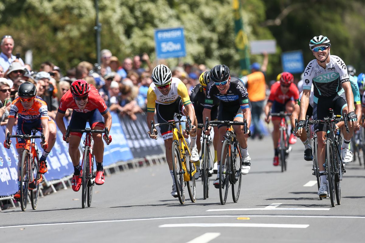 Dion Smith celebrates crossing the line for third place