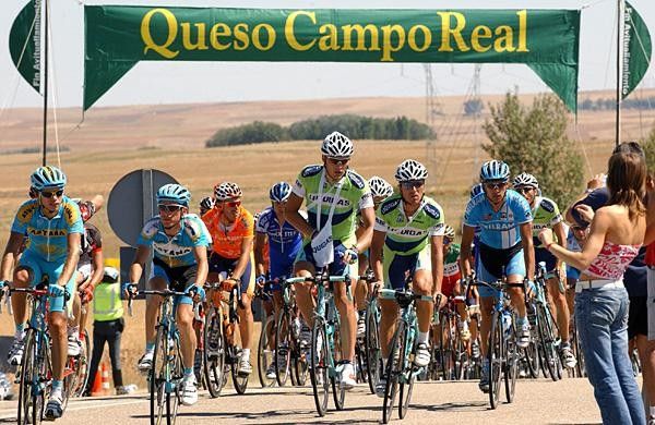 The peloton takes on some fuel.