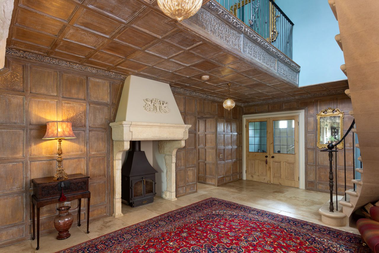 Details of the Lime House in Yorkshire. It is yellow, with a red tiled roof surrounded by green fields. Inside, wood panelled walls contrast with stone fittings and floors for a very farmhouse feel.