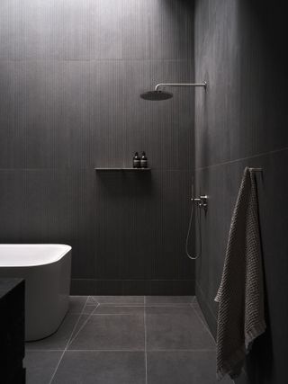 dark grey bathroom at Omar Gandhi's building for home and office life in Halifax