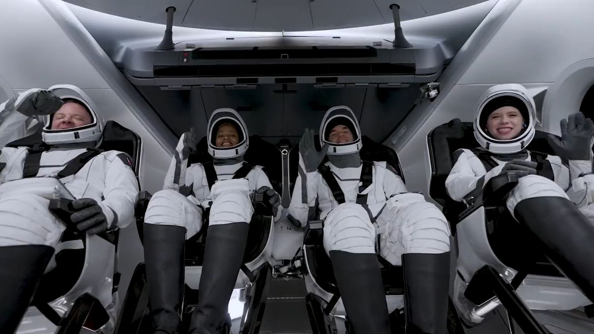 The four Inspiration4 astronauts wave and give thumb's up signs to the camera inside SpaceX's Crew Dragon Resilience as they await launch atop NASA's Pad 39A at the Kennedy Space Center in Florida on Sept. 15, 2021. They are (from left): Chris Sembroski, Sian Proctor, Jared Isaacman and Hayley Arceneaux.
