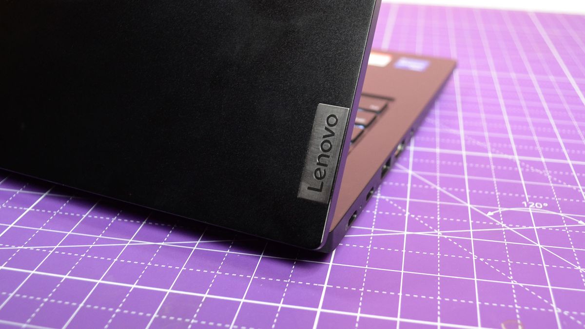 An Lenovo ThinkPad E14 Gen 5 on a purple deskmat